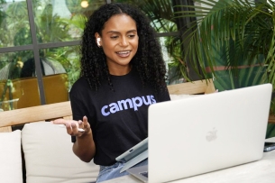 A Campus student in front of a laptop.