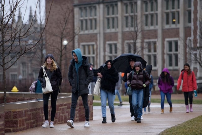 Students walk on campus at Washington University in St. Louis