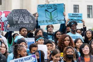 Protesters at the U.S. Supreme Court hold up handmade signs in favor of affirmative action.