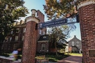 A brick gate with a Lafayette College sign