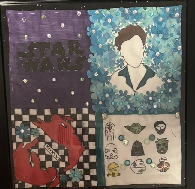 A quilt square created by one of the author's students. One of the squares shows the Star Wars logo.