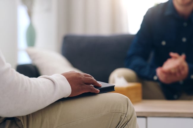 Therapist expert adviser consulting man in office